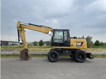 Колёсный экскаватор CATERPILLAR M313D