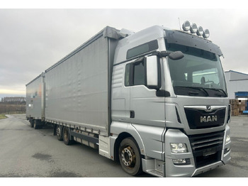 Тентованный грузовик MAN TGX 26.460