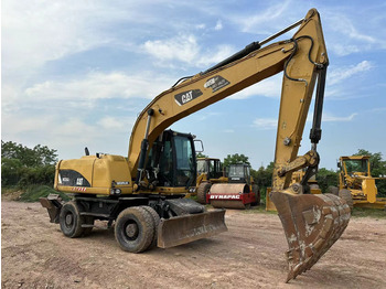 Колёсный экскаватор CATERPILLAR M320