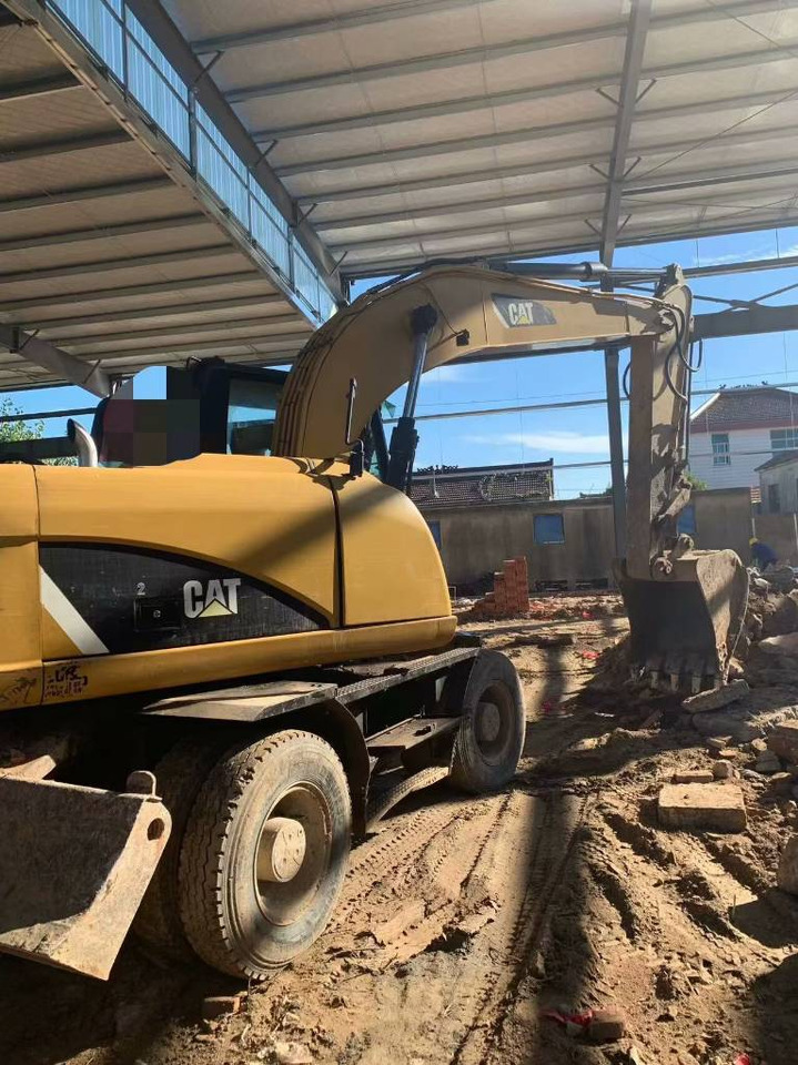 CAT M 315 D - Колёсный экскаватор: фото 1 CAT M 315 D - Колёсный экскаватор: фото 1